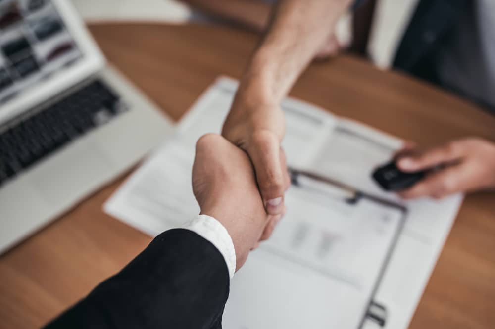 two people shaking hands
