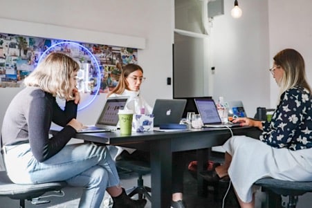 group of people at a computer