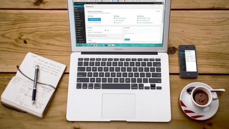 open macbook with notes and coffee
