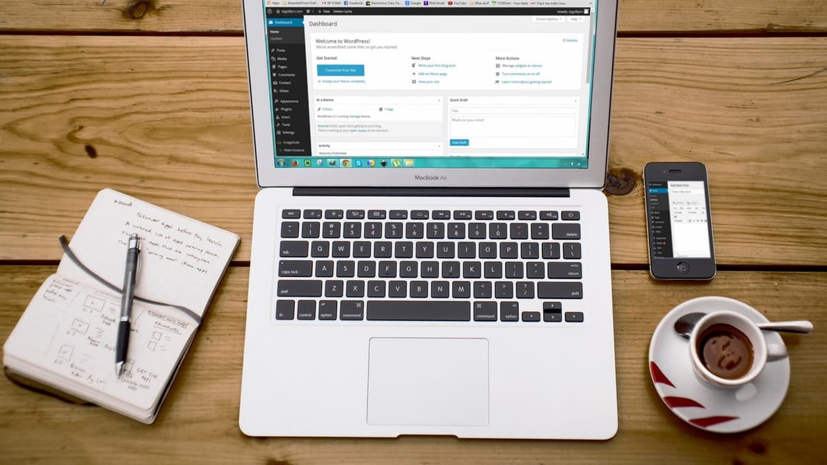 open macbook with notes and coffee