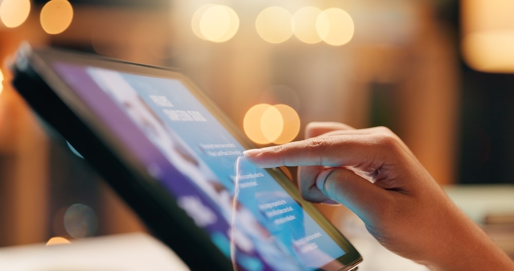 person reading tablet screen