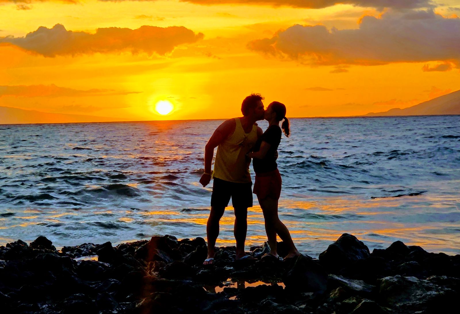 Two People Kissing on a Beach