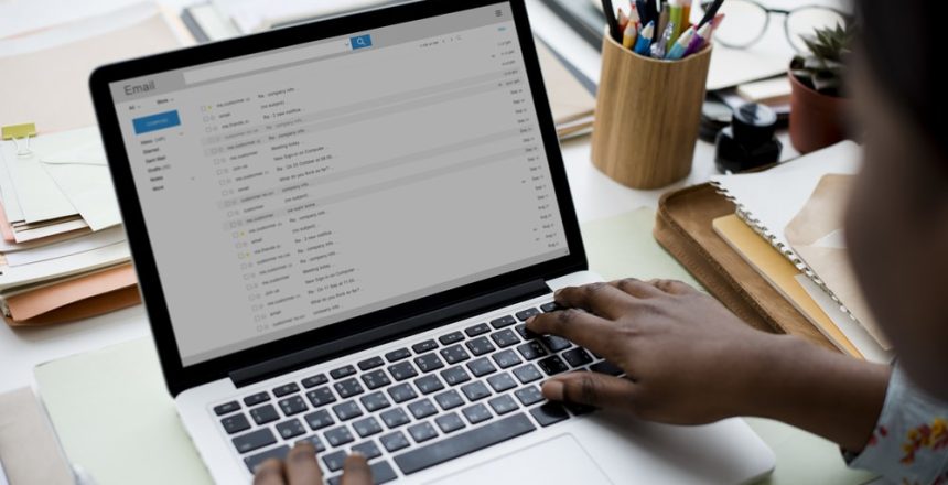 person sitting at the computer looking for subject lines